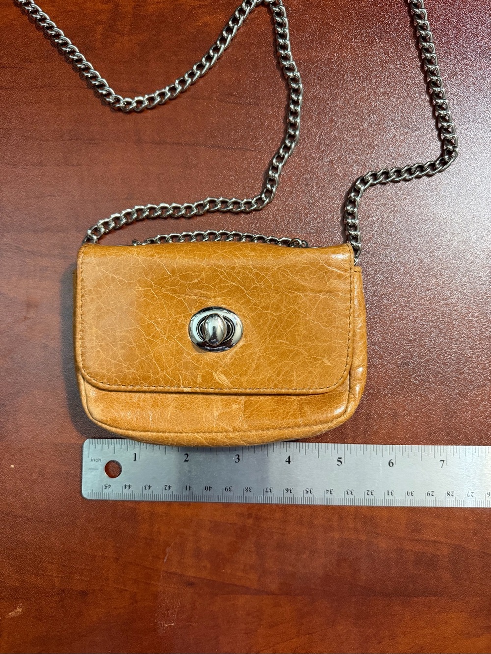 Vintage HOBO International Tan Leather Turnlock Mini Crossbody Bag.